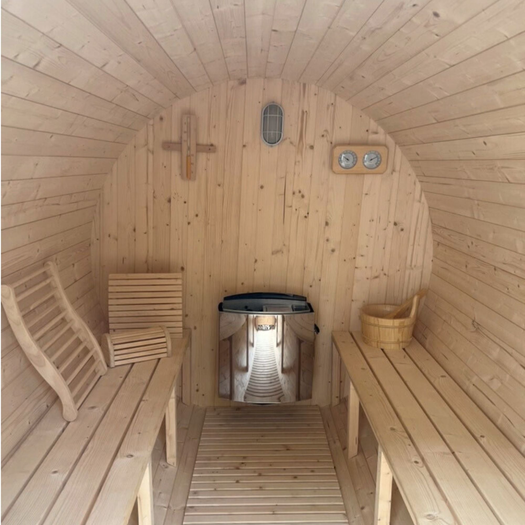 Interior layout of Bayther barrel sauna showing wooden benches and electric heater