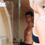 People using outdoor wood fired barrel sauna