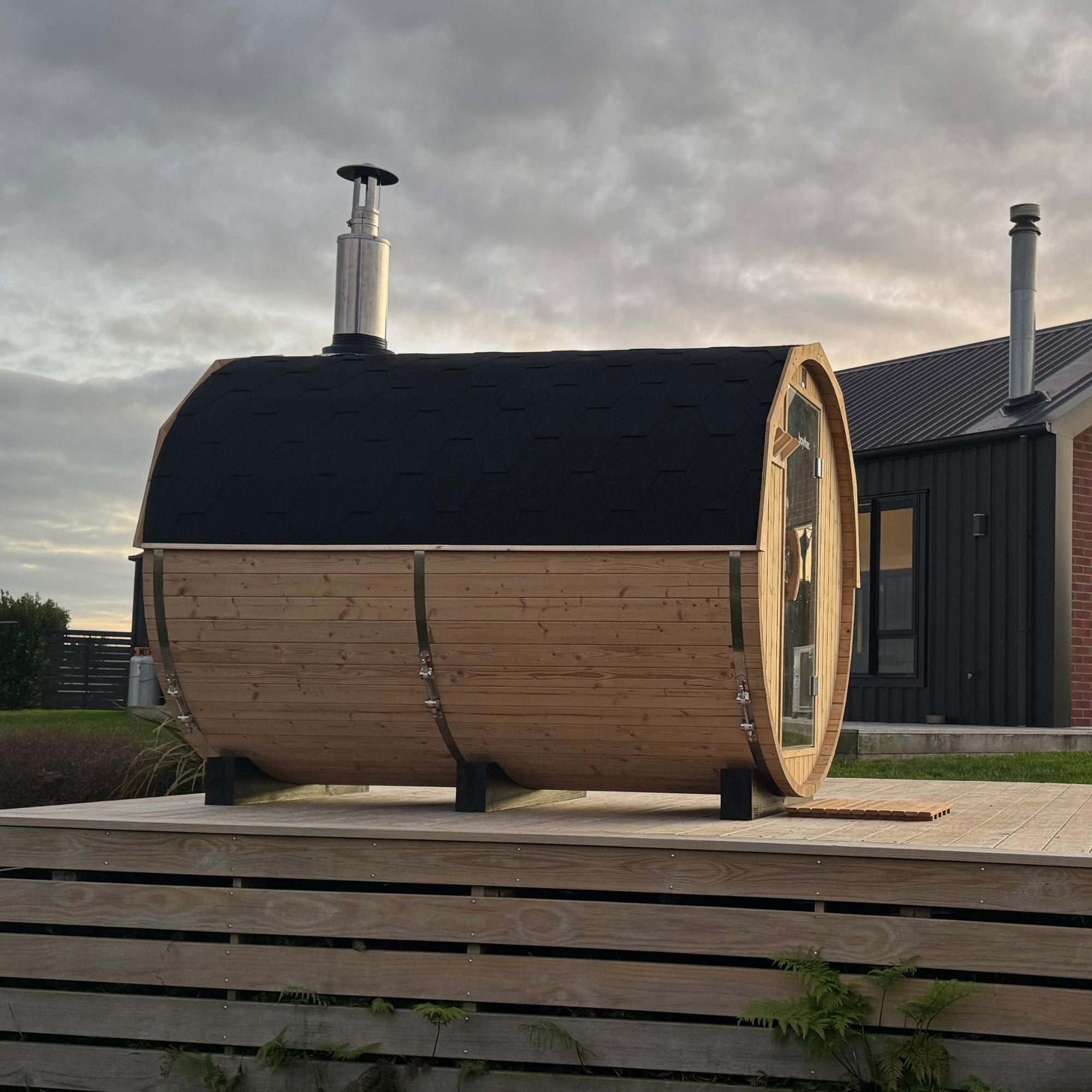 Side view of 4–6 person wood fired outdoor barrel sauna